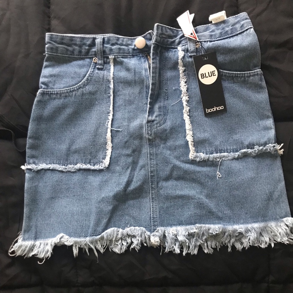 Boohoo mini jean skirt. Never worn. Size 6